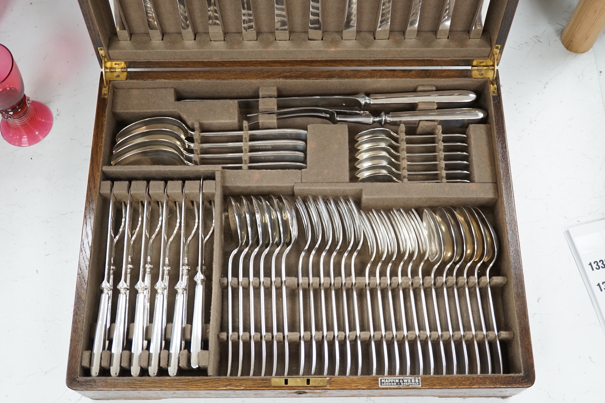 A Mappin and Webb oak canteen of silver plated cutlery, case 44 x 35 x 11cm. Condition fair to good, some staining to top of canteen, contents good.